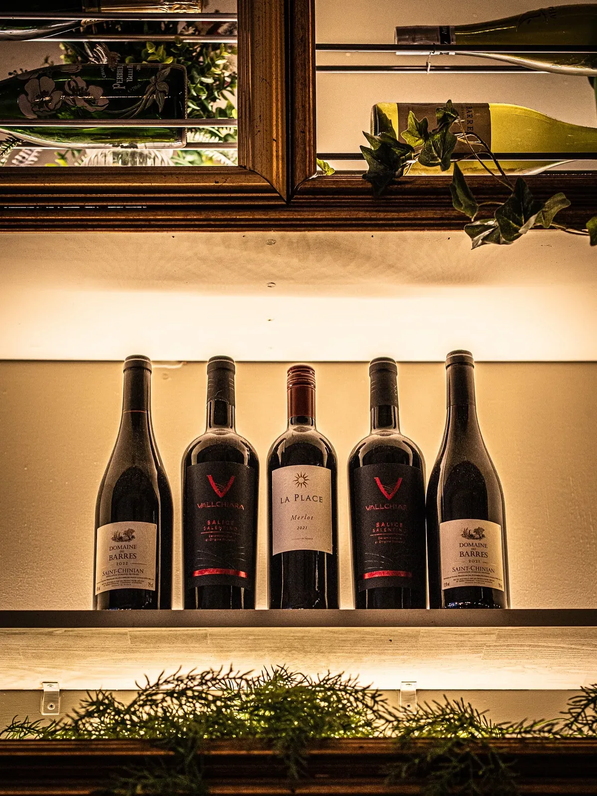 Wine bottles on the bar shelf